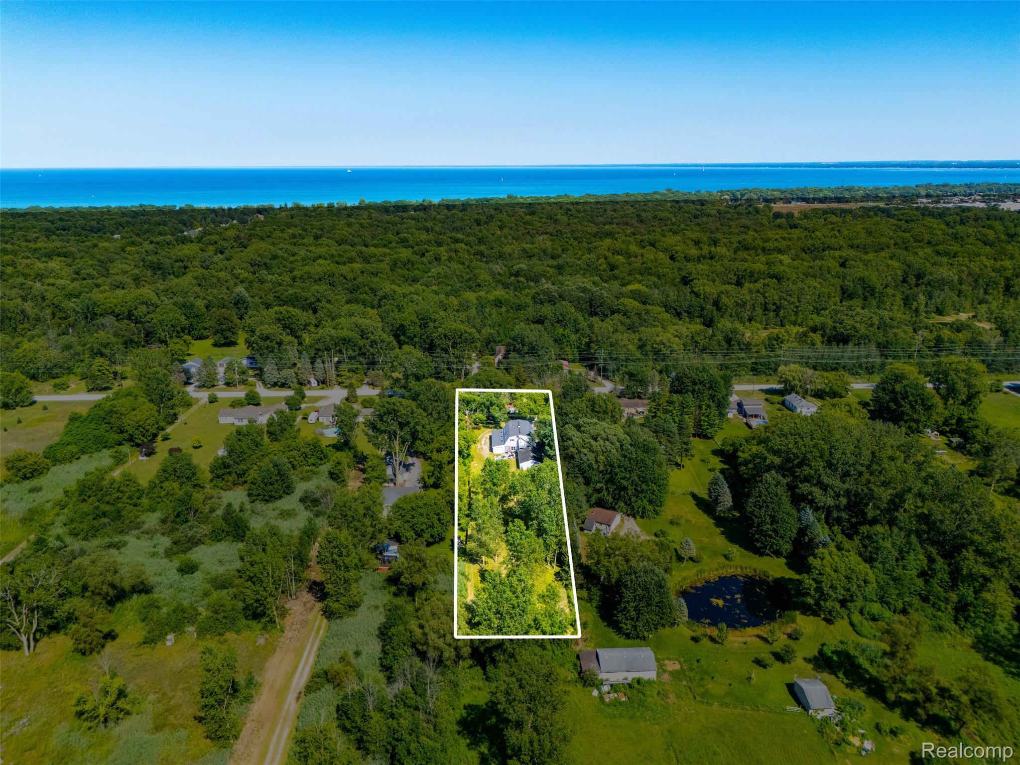 5161 Parker Road Fort Gratiot, MI 48059 - Photo 58 of 64 Expansive aerial parcel featuring a single-family residence, mature trees, and a nearby body of water