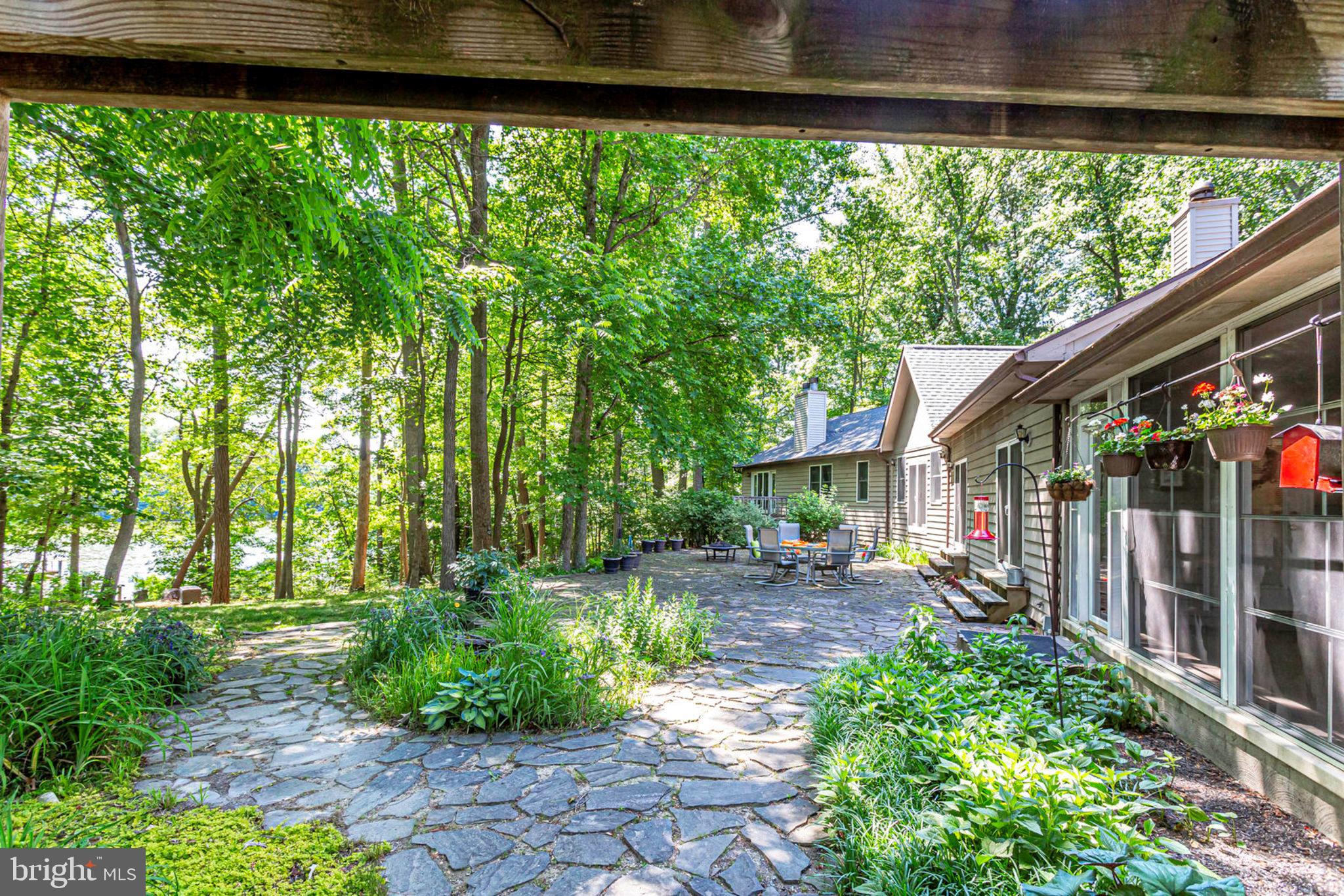 18254 Cherryfield Road Drayden, MD 20630 - Photo 2 of 34 water side of home w/ screened porch & slate patio