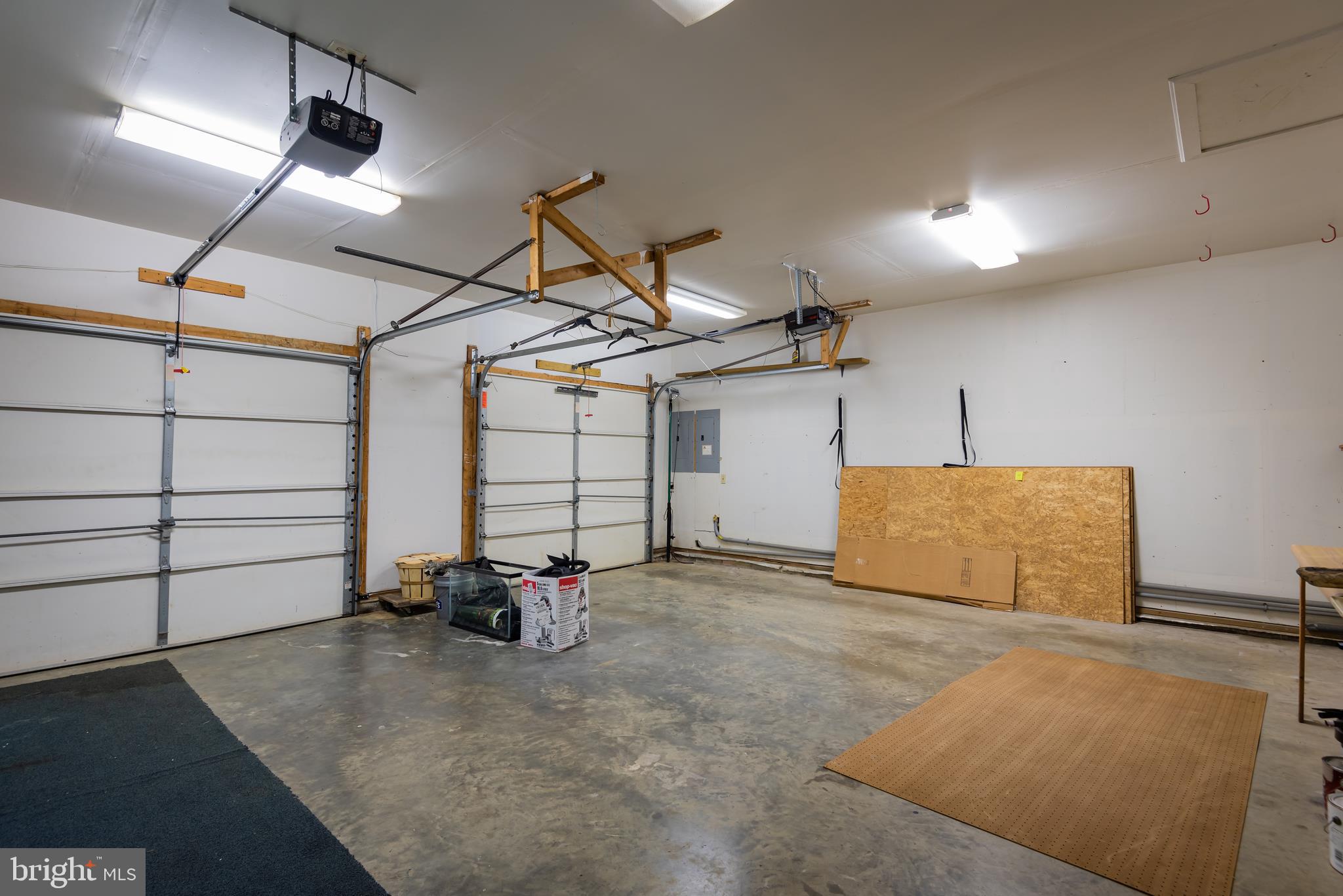 18254 Cherryfield Road Drayden, MD 20630 - Photo 28 of 34 oversized 2 car garage with shelving