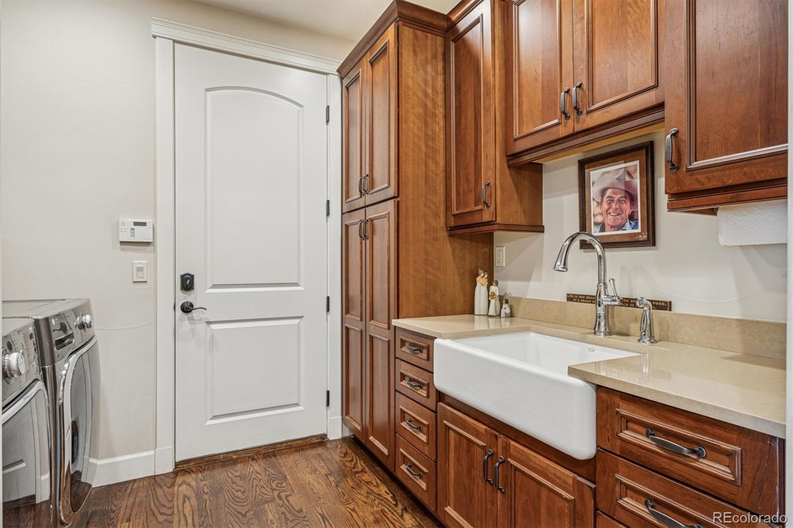 2065 Primo Road, Unit F Highlands Ranch, CO 80129 - Photo 11 of 37 a kitchen with a sink and a refrigerator