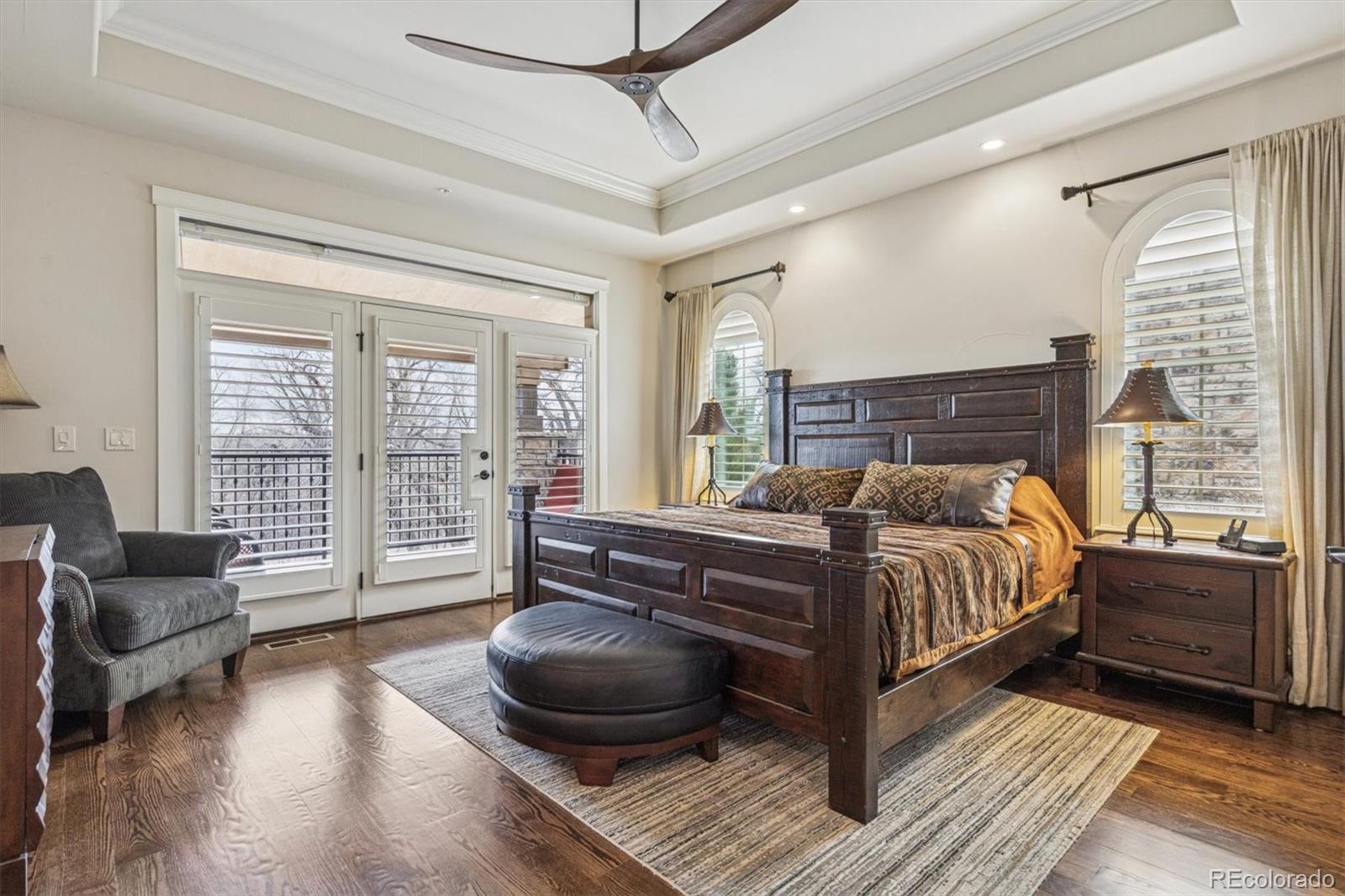 2065 Primo Road, Unit F Highlands Ranch, CO 80129 - Photo 18 of 37 a bedroom with a bed and a couch