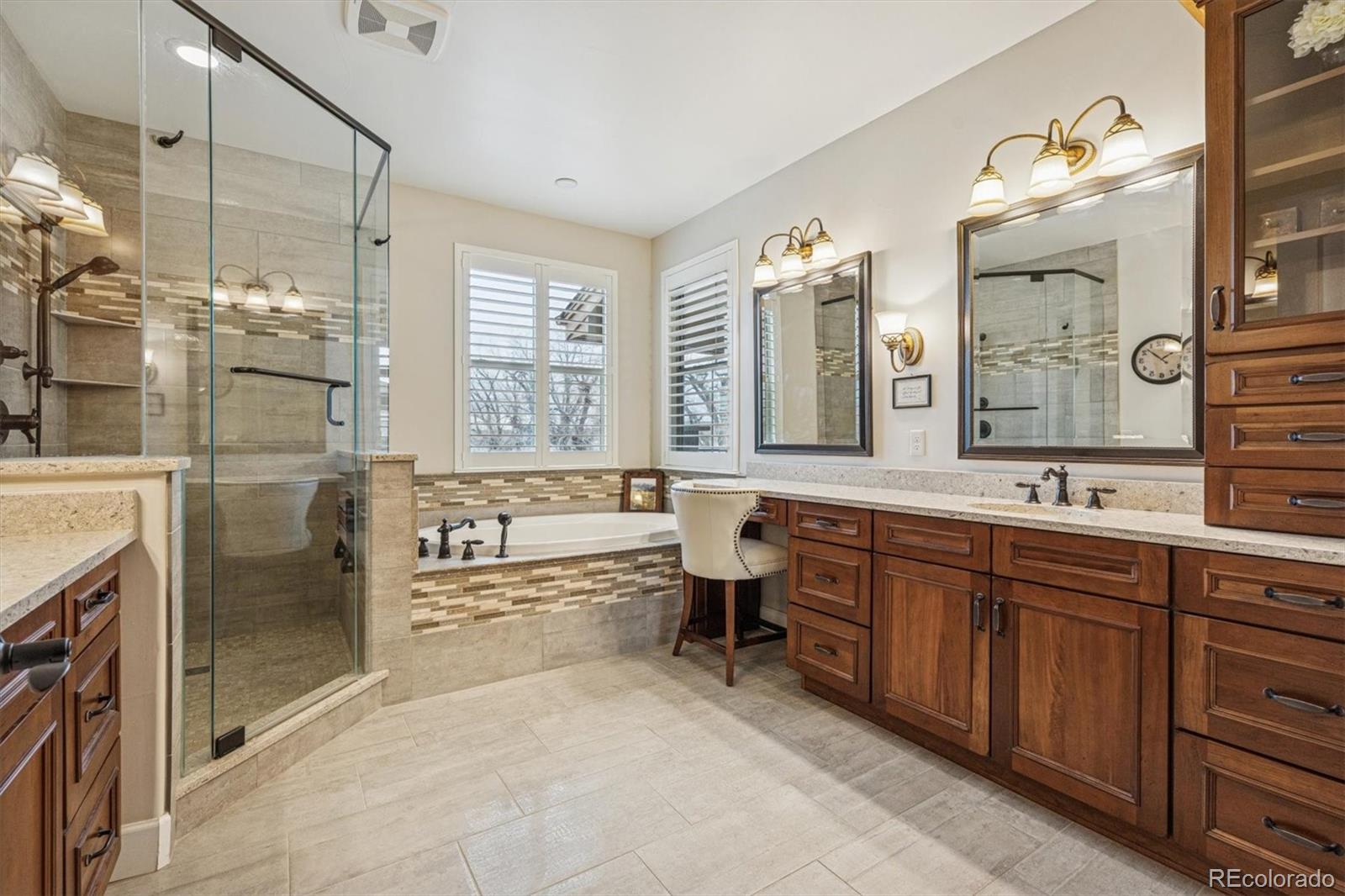 2065 Primo Road, Unit F Highlands Ranch, CO 80129 - Photo 21 of 37 a spacious bathroom with a bathtub sink and double vanity