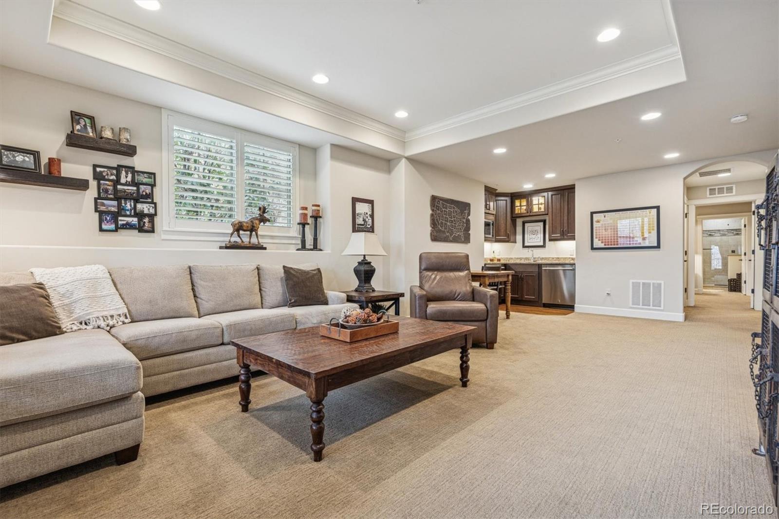 2065 Primo Road, Unit F Highlands Ranch, CO 80129 - Photo 27 of 37 a living room with furniture and a large window