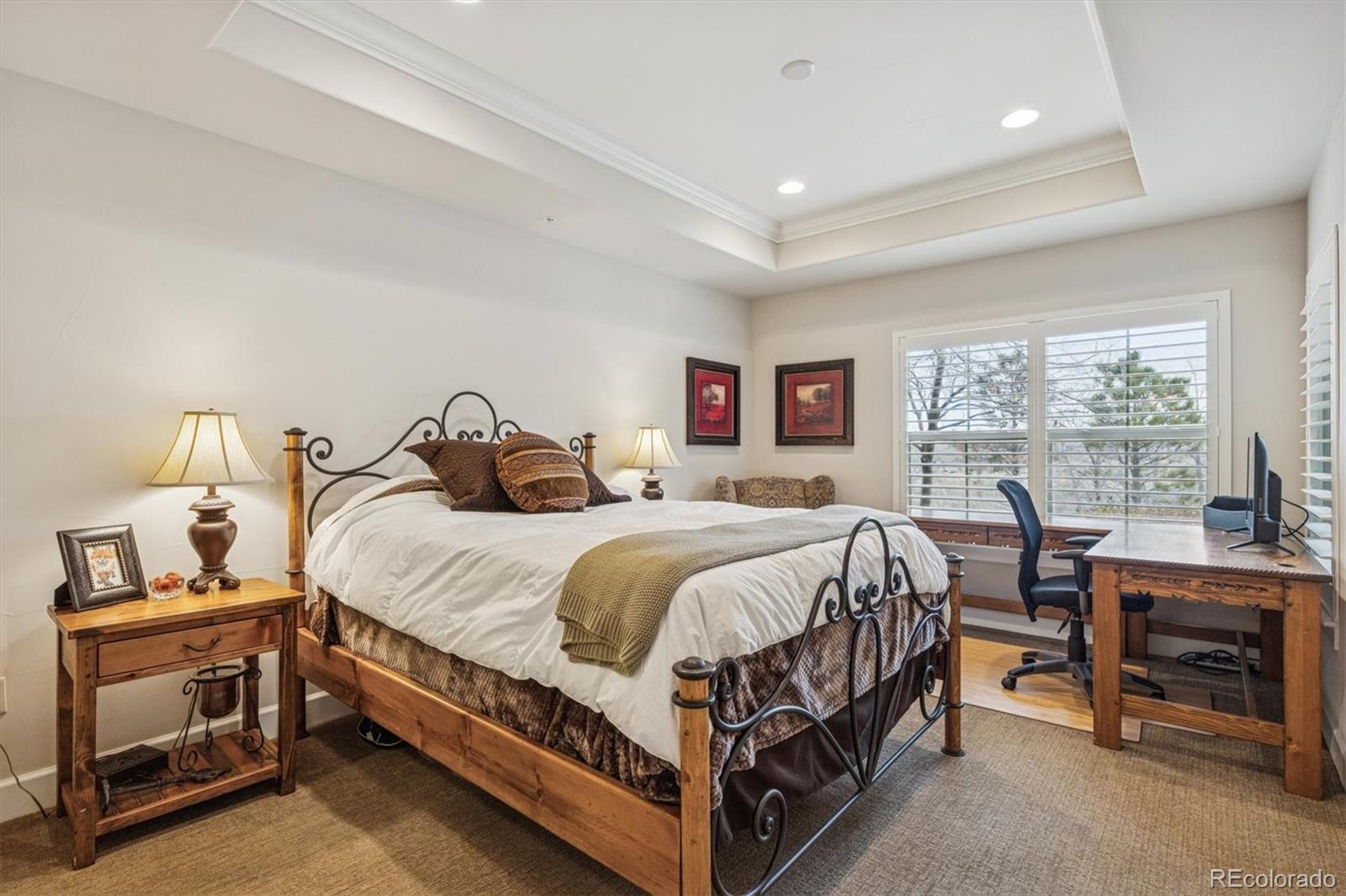 2065 Primo Road, Unit F Highlands Ranch, CO 80129 - Photo 29 of 37 a bed room with a bed and a window