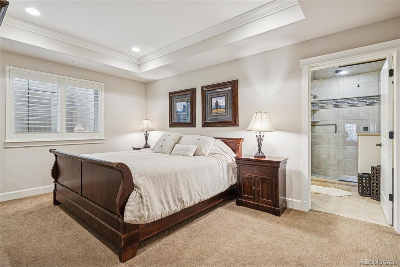 2065 Primo Road, Unit F Highlands Ranch, CO 80129 - Photo 31 of 37 a spacious bedroom with a bed and a cabinets