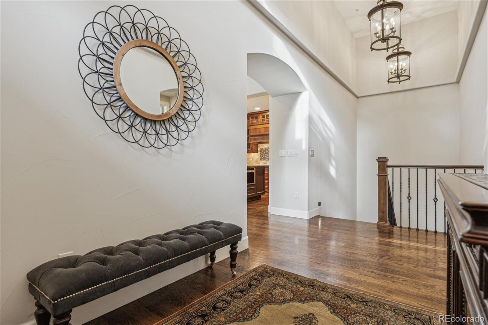 2065 Primo Road, Unit F Highlands Ranch, CO 80129 - Photo 6 of 37 a room with furniture and wooden floor