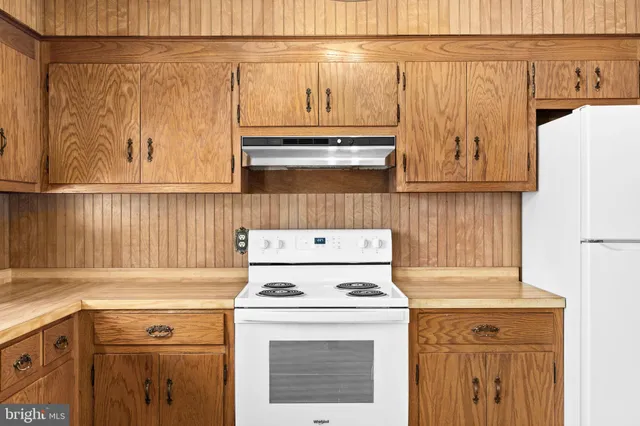 a kitchen with a sink cabinets and window