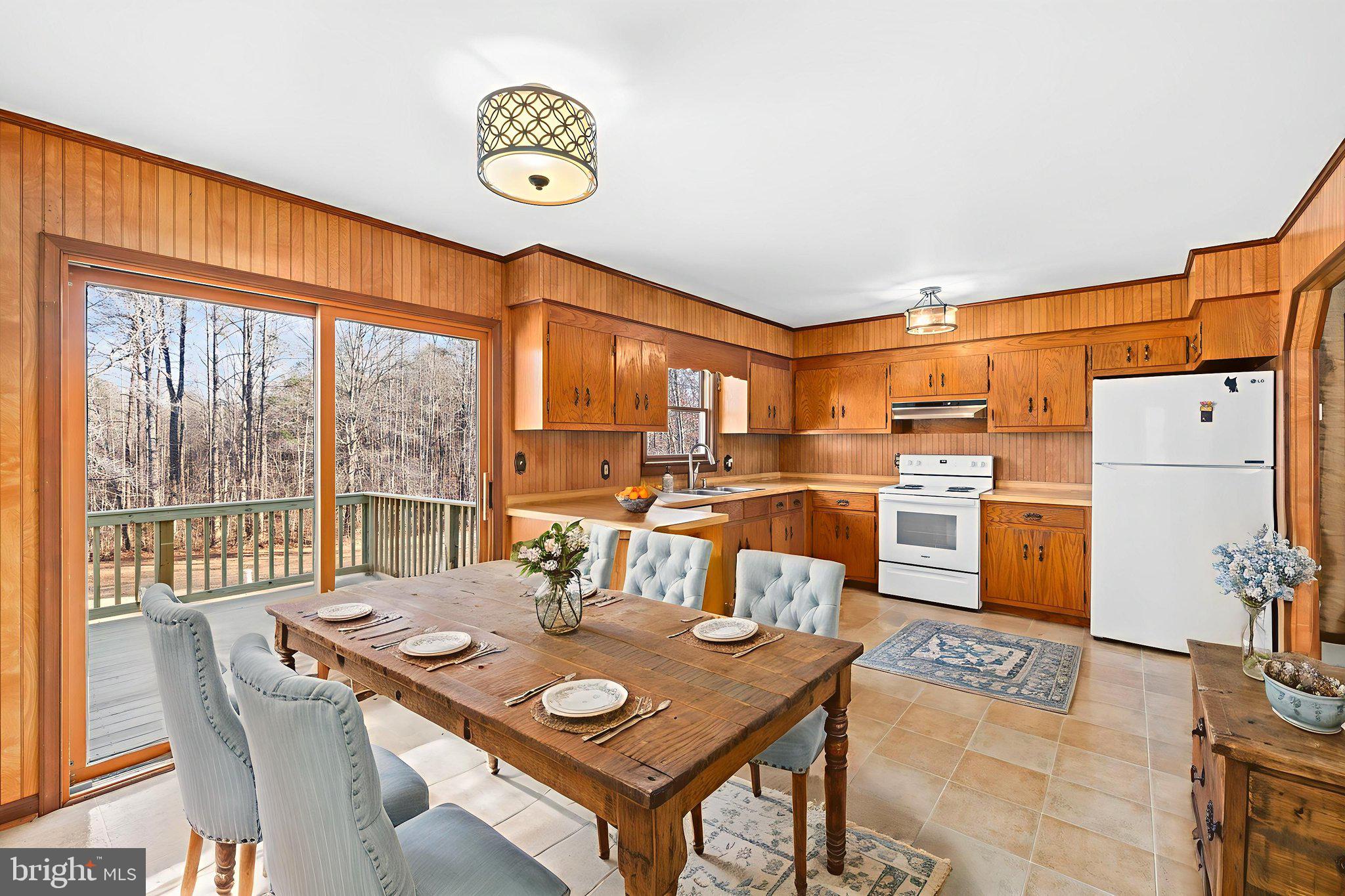 16125 Mountain Track Road Orange, VA 22960 - Photo 18 of 60 a view of a dining room with furniture window and kitchen view