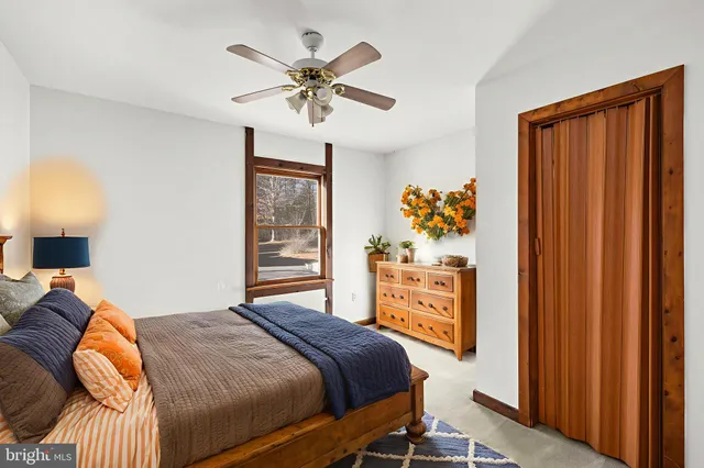 an empty room with windows and closet