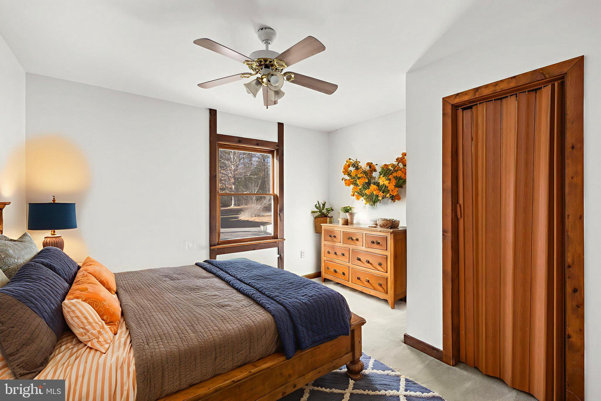 16125 Mountain Track Road Orange, VA 22960 - Photo 21 of 60 a bedroom with a bed and wooden floor