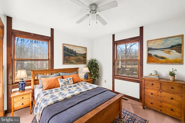 an empty room with windows and closet