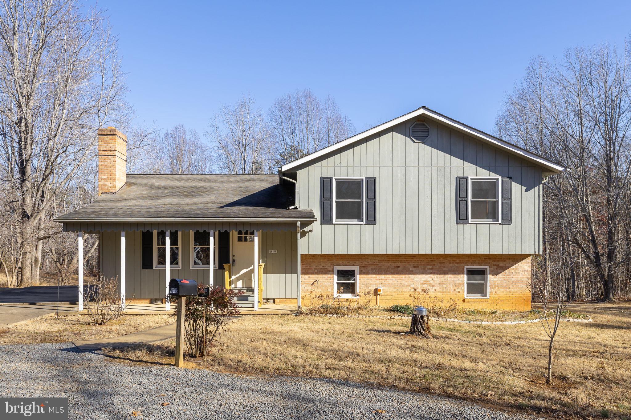 16125 Mountain Track Road Orange, VA 22960 - Photo 4 of 60 a front view of a house with garden