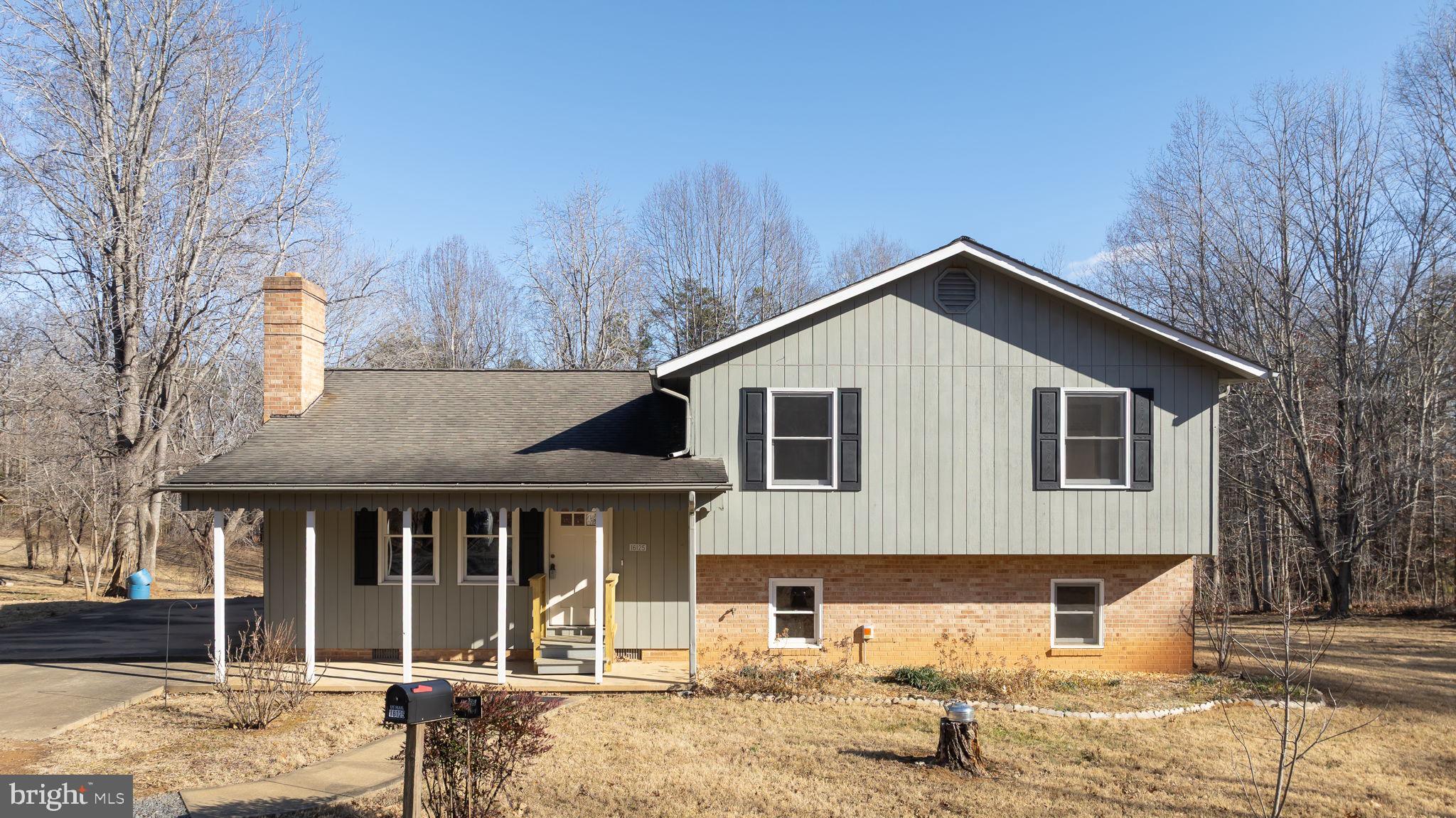 16125 Mountain Track Road Orange, VA 22960 - Photo 59 of 60 a front view of a house with a yard and garage