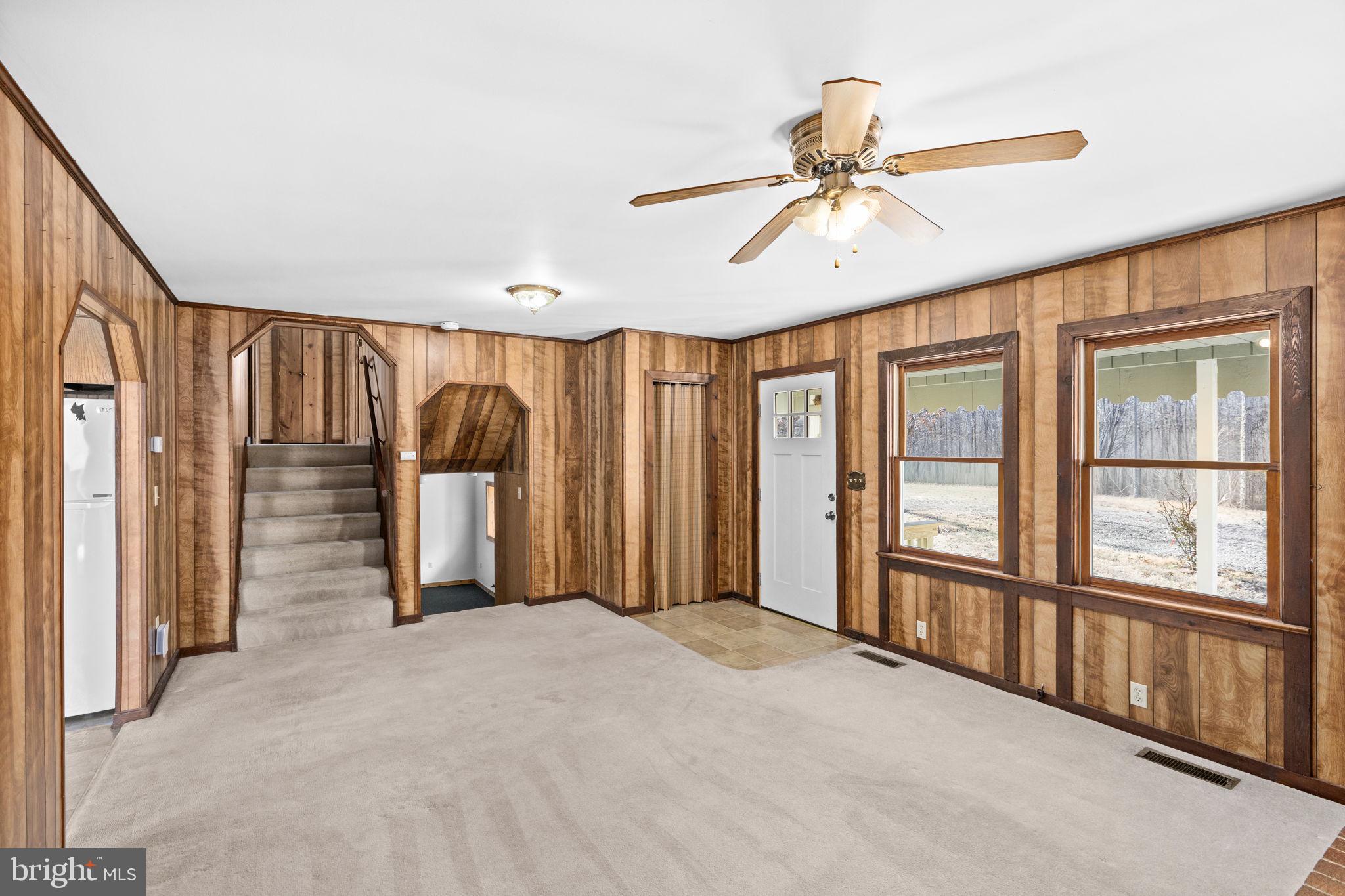 16125 Mountain Track Road Orange, VA 22960 - Photo 10 of 60 a view of a livingroom with a staircase