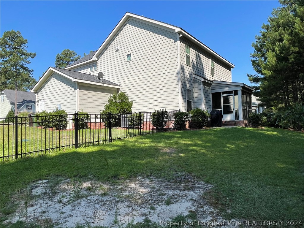 419 Rolling Pines Drive Spring Lake, NC 28390 - Photo 2 of 2 a front view of house with yard and green space