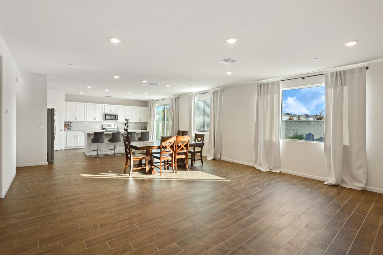 2004 Ravine Lane Manteca, CA 95337 - Photo 12 of 28 a view of dining room with furniture and wooden floor
