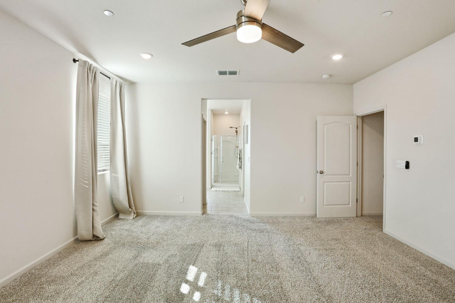 2004 Ravine Lane Manteca, CA 95337 - Photo 16 of 28 a view of empty room with a ceiling fan