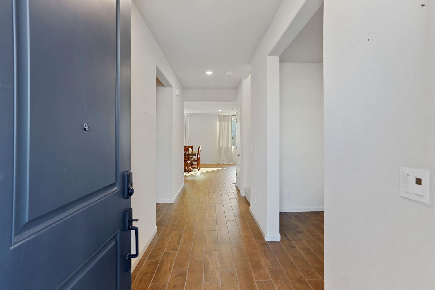 2004 Ravine Lane Manteca, CA 95337 - Photo 2 of 28 a view of a hallway with wooden floor