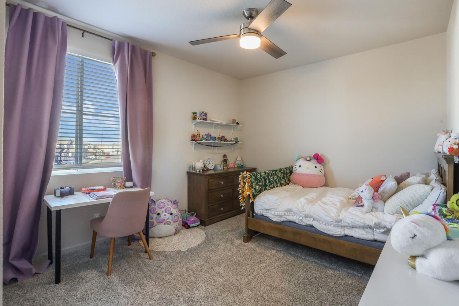 2004 Ravine Lane Manteca, CA 95337 - Photo 23 of 28 a bedroom with a bed and a chandelier