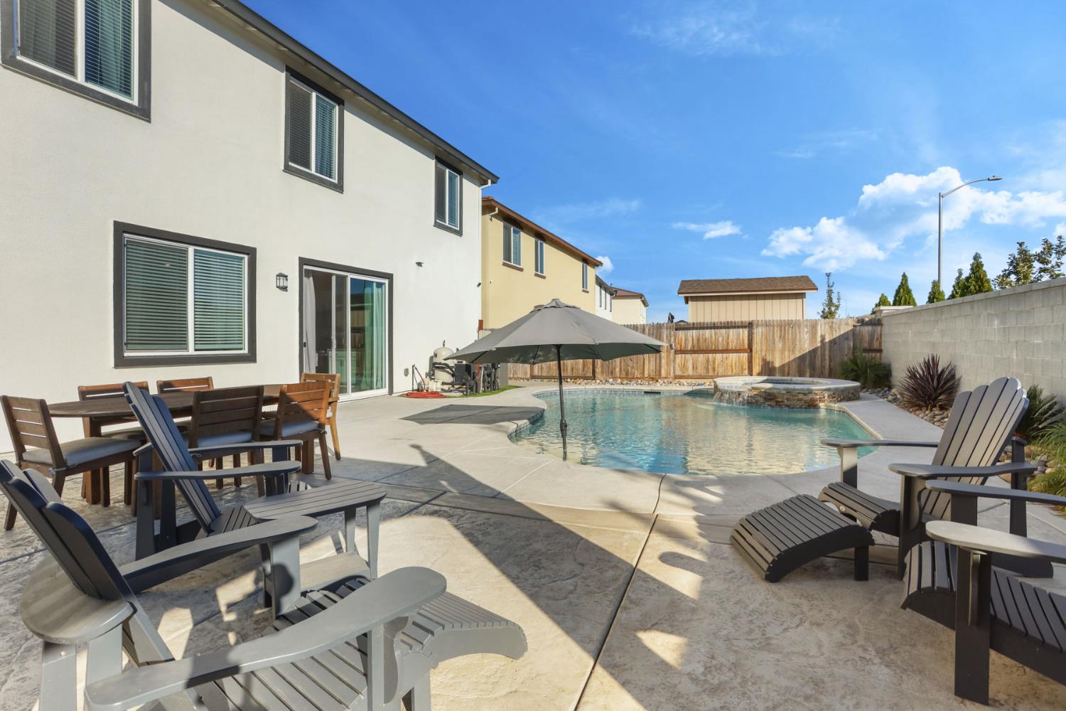 2004 Ravine Lane Manteca, CA 95337 - Photo 28 of 28 a view of a swimming pool with outdoor seating