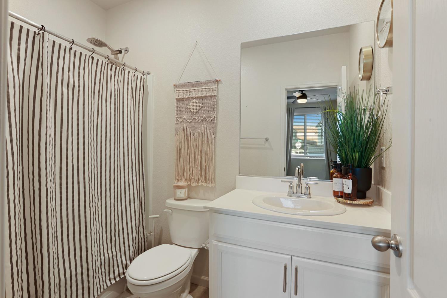 2004 Ravine Lane Manteca, CA 95337 - Photo 5 of 28 a bathroom with a sink a toilet and shower