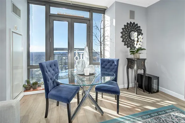 a living room with furniture and a chandelier