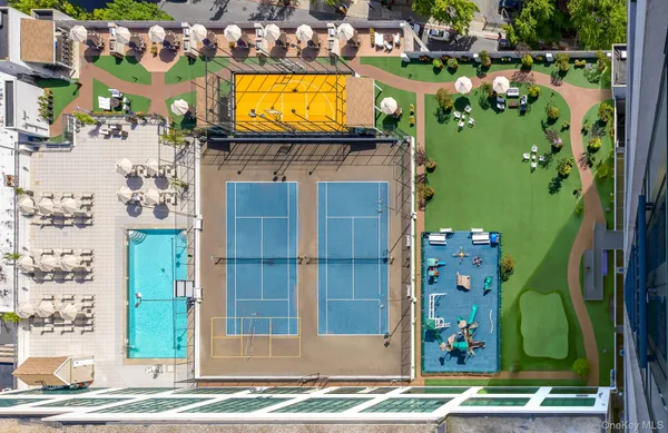 a roof deck with a table and chairs