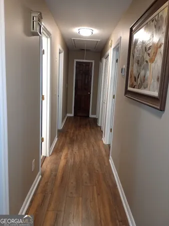 a view of gallery with wooden floor