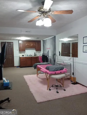 a living room with a couch and chandelier