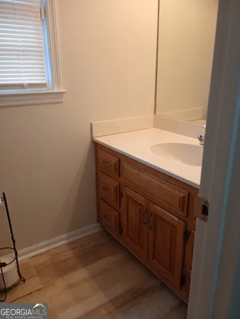 a view of storage and utility room with wooden floor