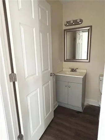 a bathroom with a sink a mirror and a window