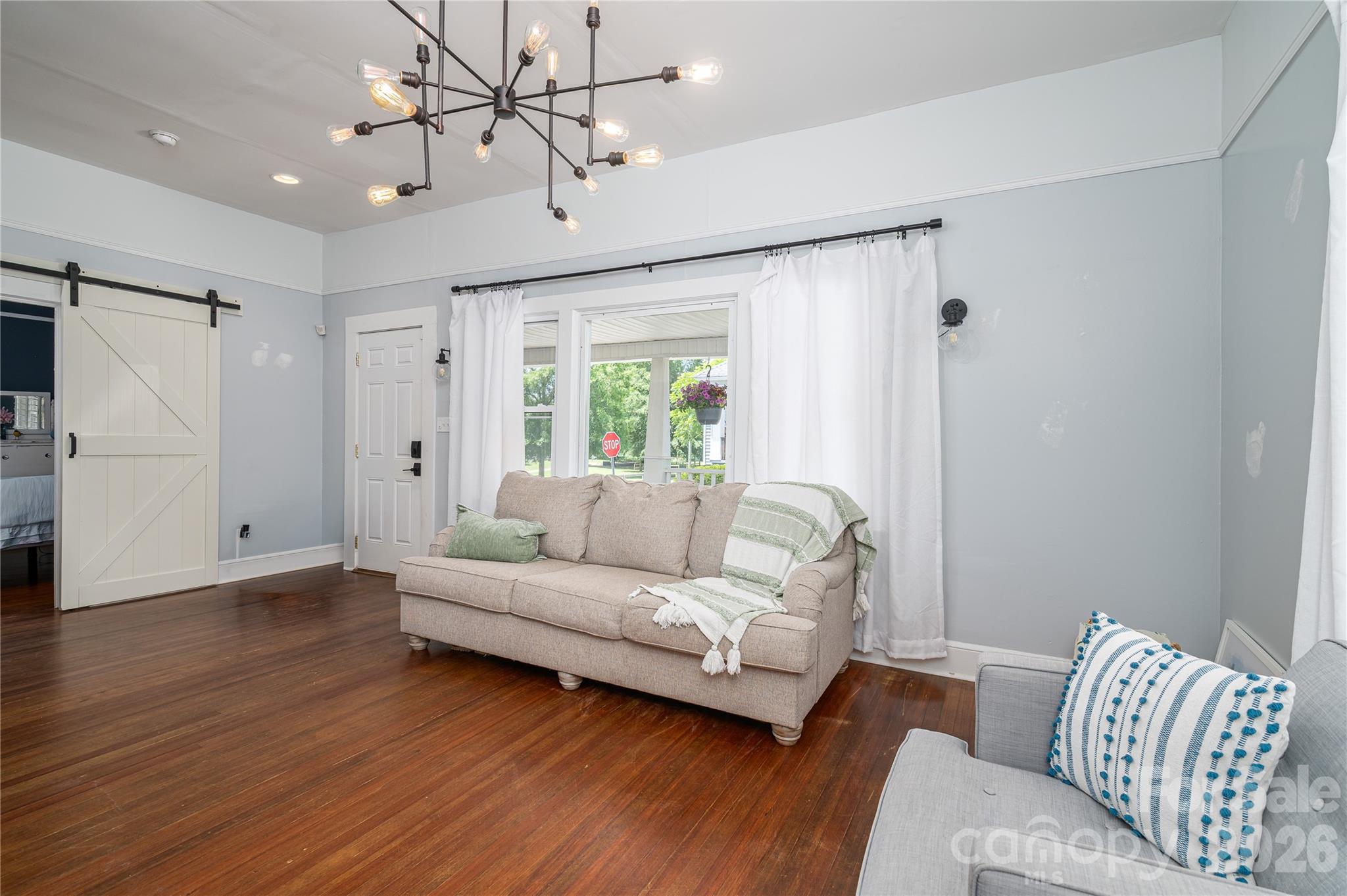 58 Fourth Street Cramerton, NC 28032 - Photo 18 of 44 a living room with furniture and a large window