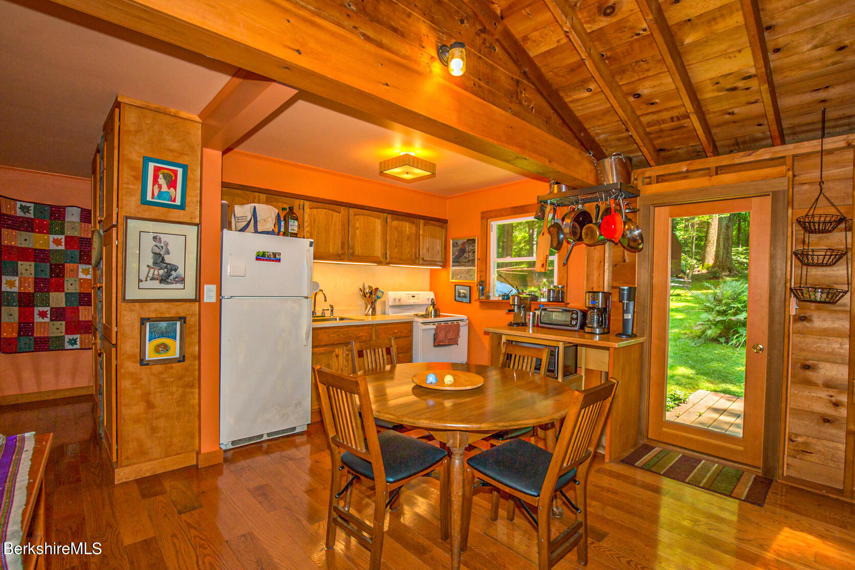 1 Massasoit Road Stockbridge, MA 01262 - Photo 11 of 28 a dining room with furniture and a floor to ceiling window