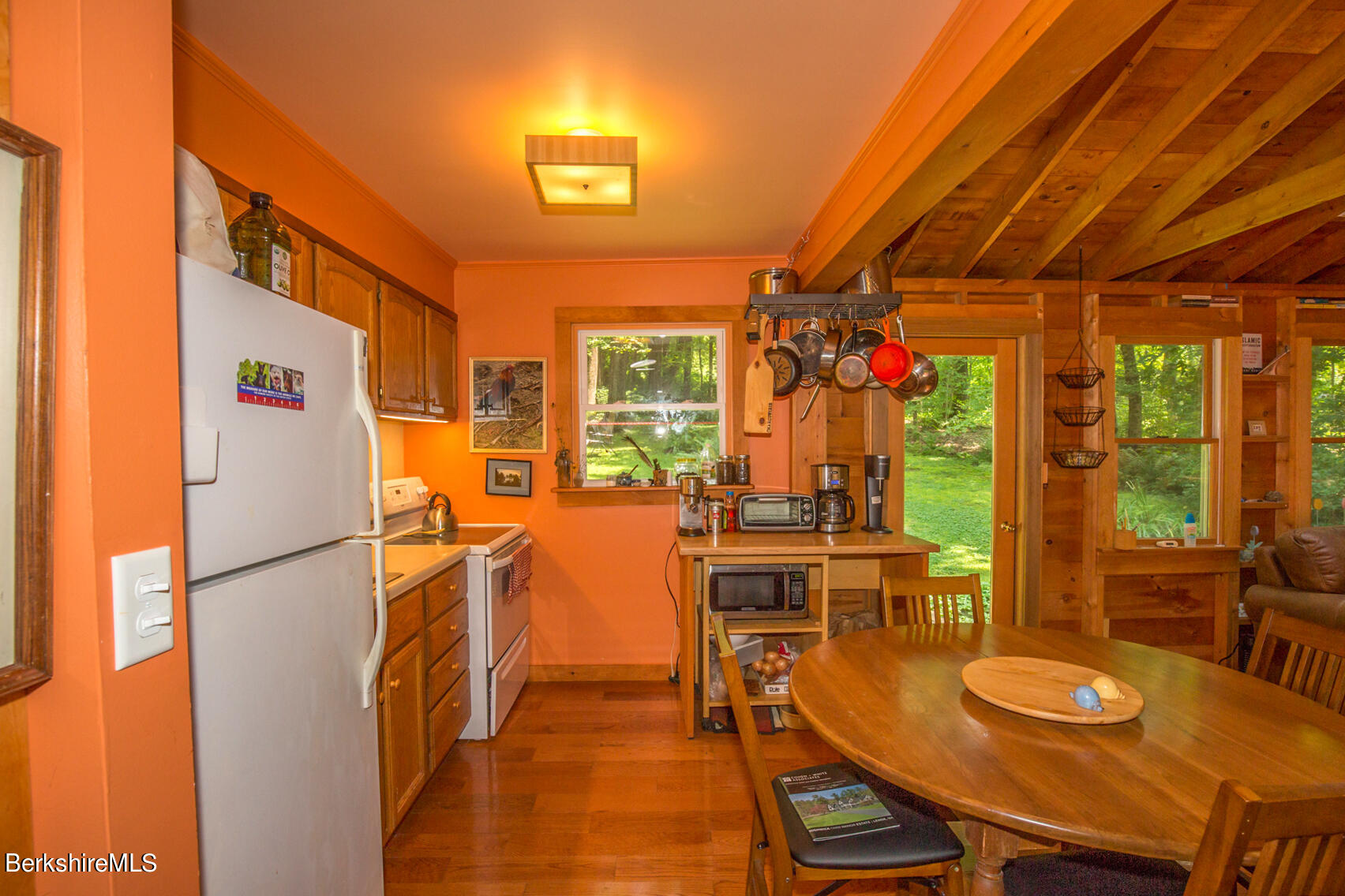 1 Massasoit Road Stockbridge, MA 01262 - Photo 13 of 28 a dining room with furniture a window and kitchen view