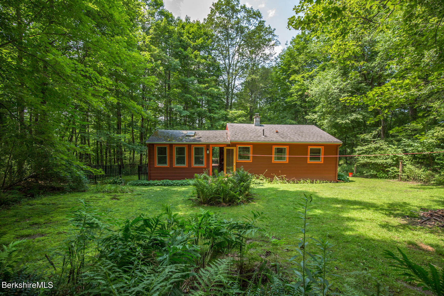 1 Massasoit Road Stockbridge, MA 01262 - Photo 20 of 28 a view of a house with backyard