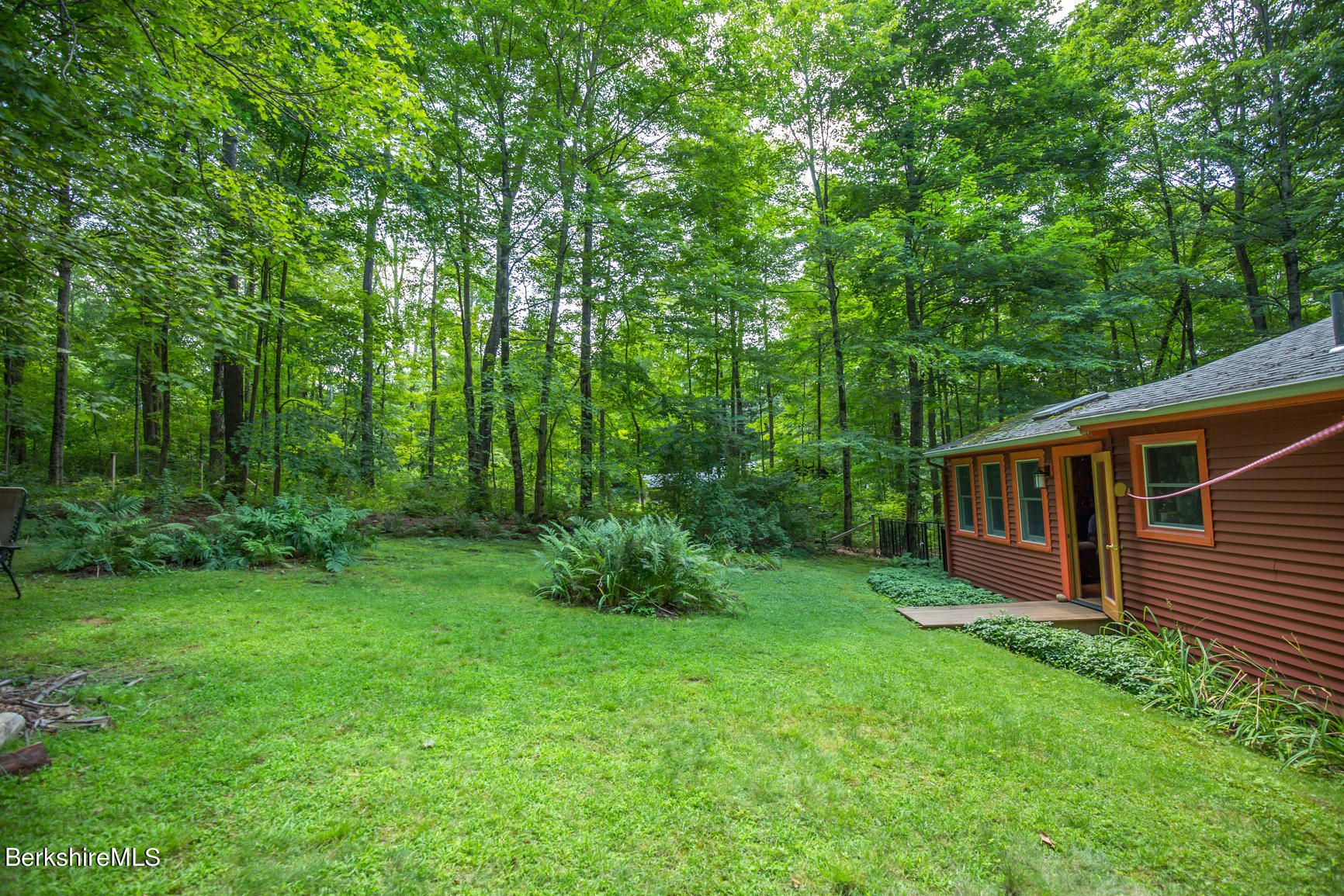 1 Massasoit Road Stockbridge, MA 01262 - Photo 21 of 28 a view of a house with backyard and garden