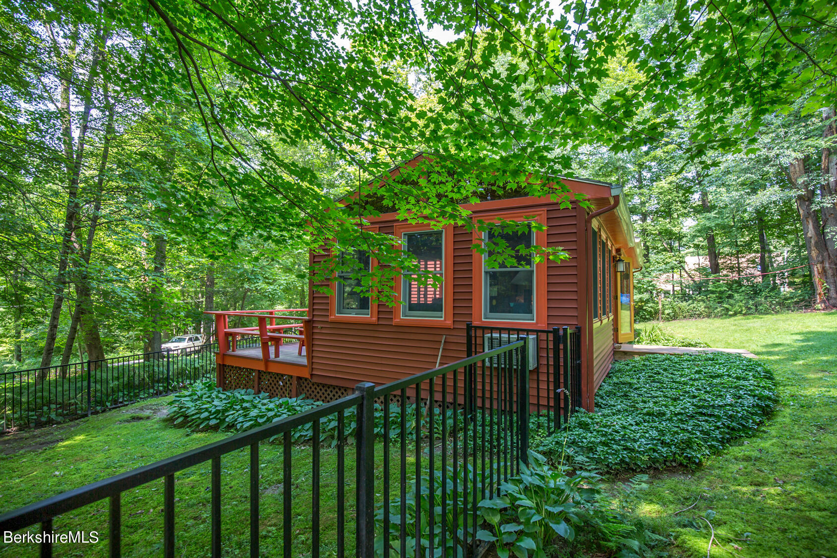 1 Massasoit Road Stockbridge, MA 01262 - Photo 4 of 28 a front view of a house with a garden