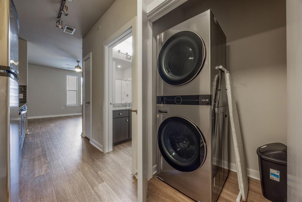1900 Barton Springs Road, Unit 3013 Austin, TX 78704 - Photo 16 of 27 A convenient stacked laundry area awaits, optimizing space within this home's thoughtful layout.