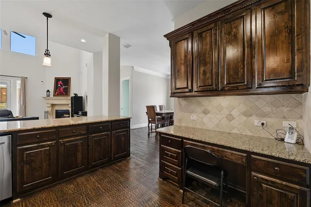 a kitchen with wooden cabinets and refrigerator