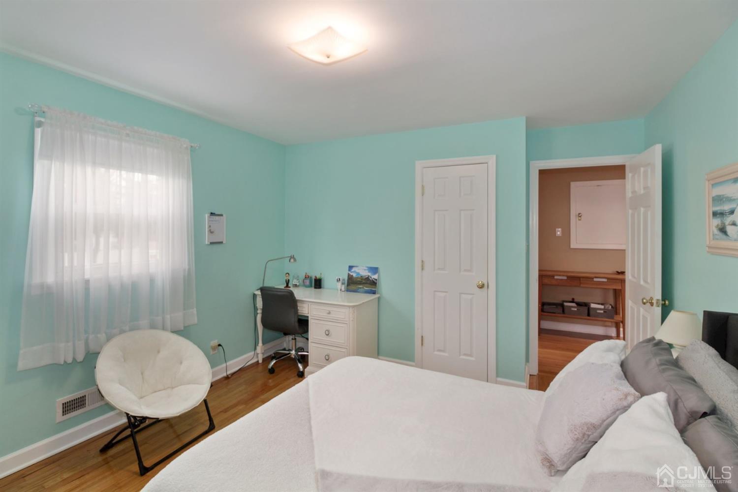 12 Hudson Road East Brunswick, NJ 08816 - Photo 14 of 30 a bedroom with a bed and a chandelier