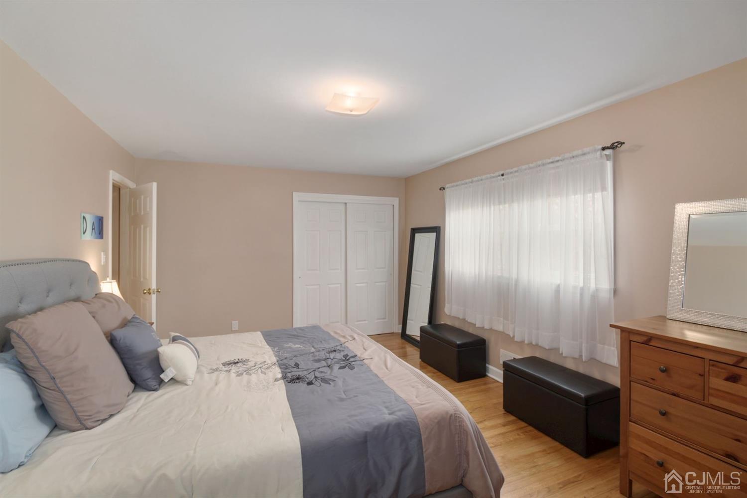 12 Hudson Road East Brunswick, NJ 08816 - Photo 17 of 30 a bedroom with a bed and a mirror