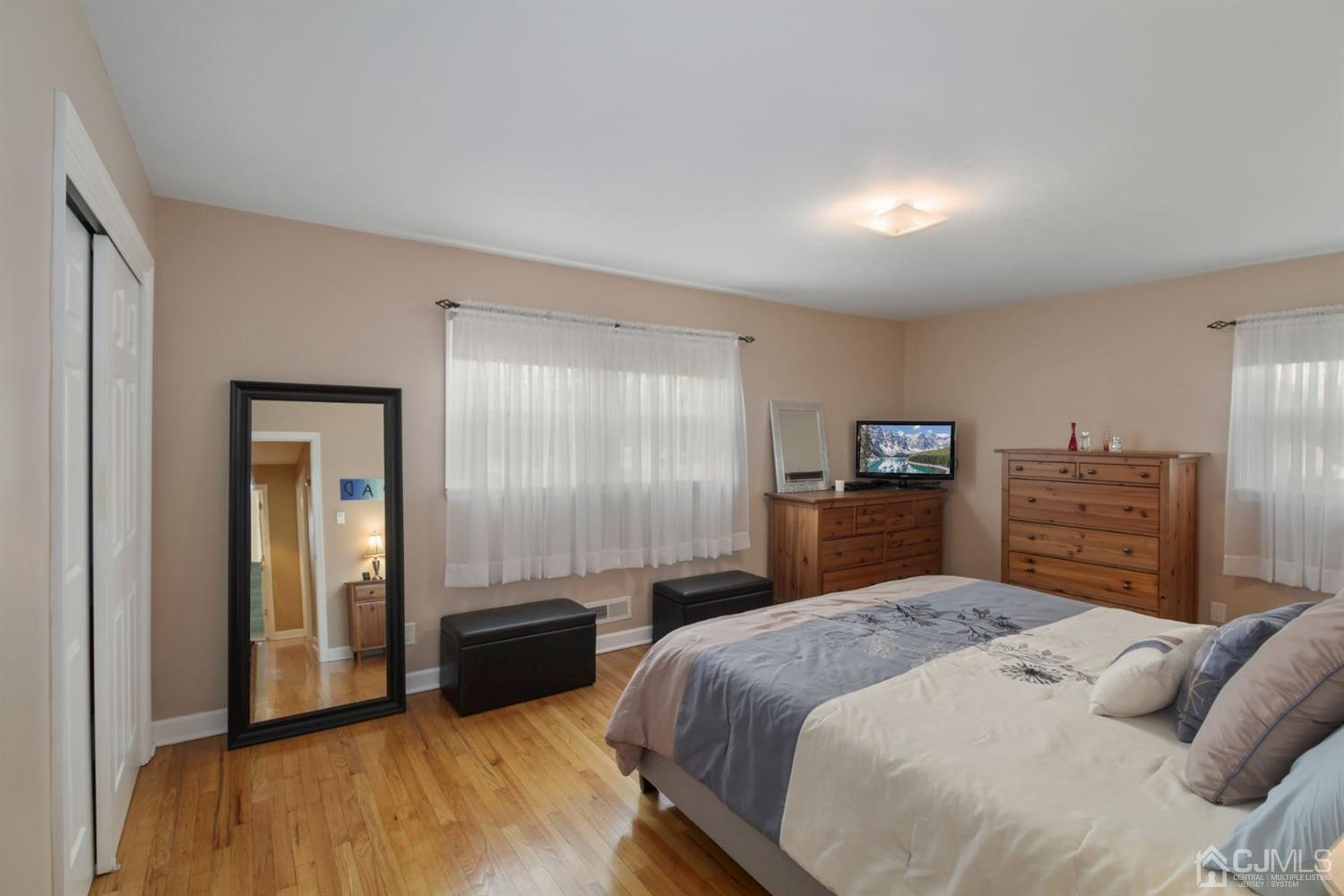 12 Hudson Road East Brunswick, NJ 08816 - Photo 18 of 30 a bedroom with a bed and a television