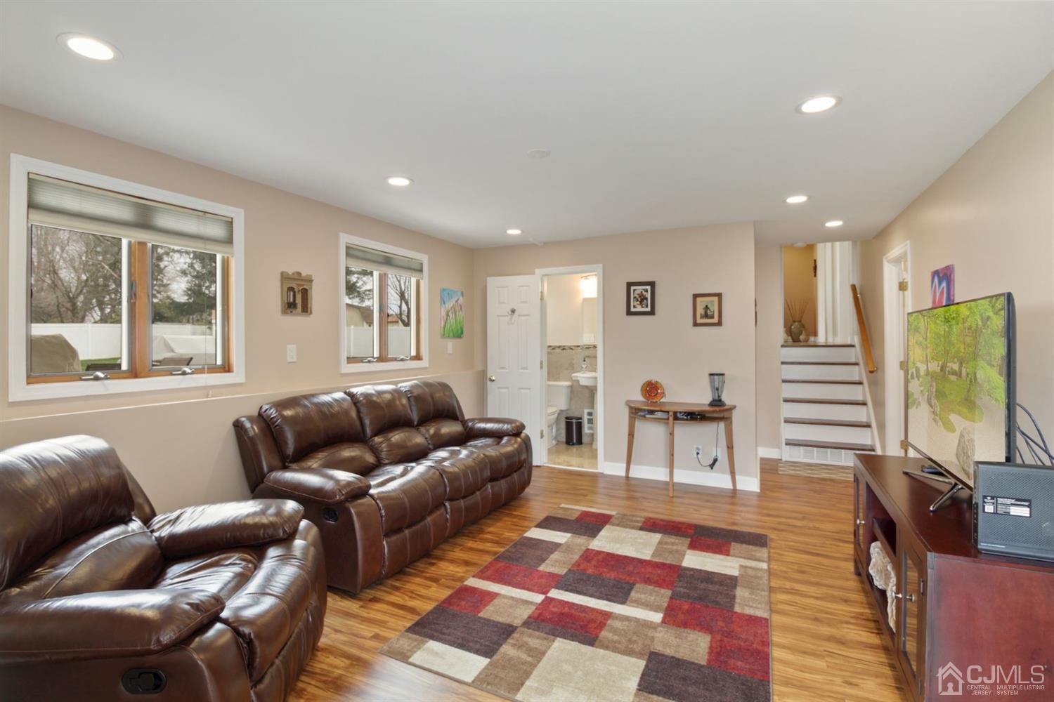 12 Hudson Road East Brunswick, NJ 08816 - Photo 21 of 30 a living room with furniture and a flat screen tv