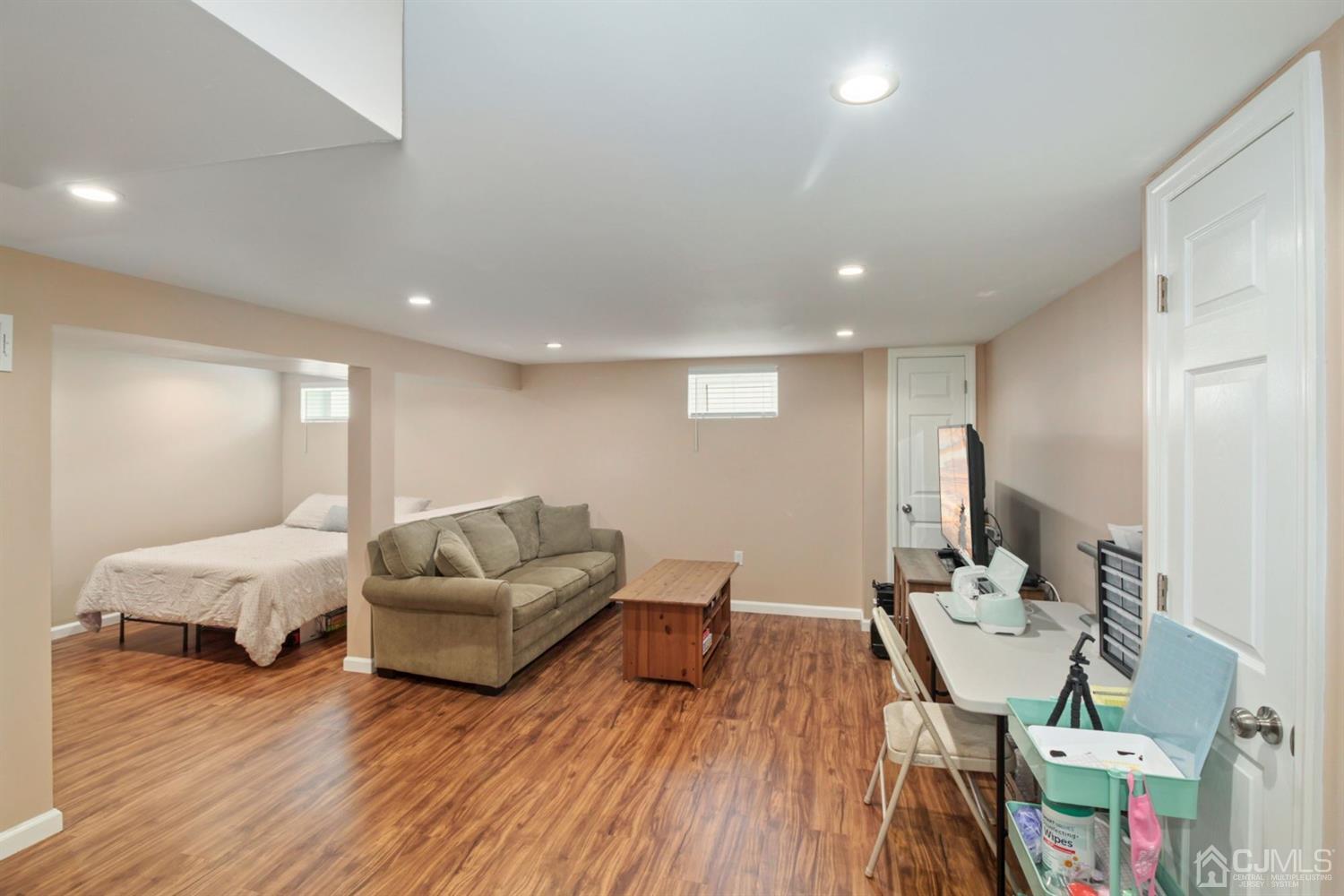 12 Hudson Road East Brunswick, NJ 08816 - Photo 23 of 30 a living room with furniture and a wooden floor