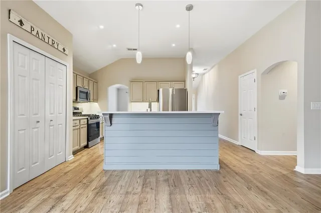 a view of kitchen and wooden floor