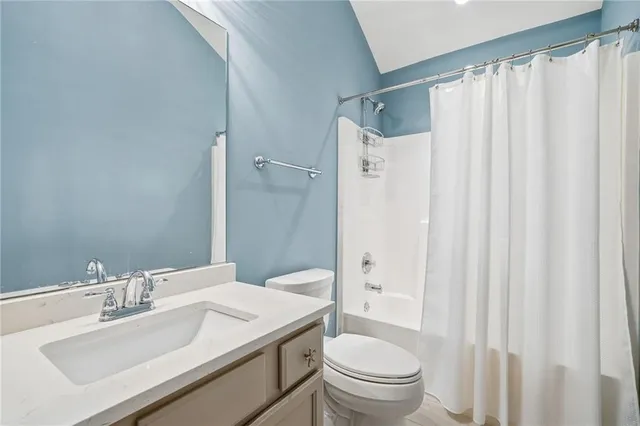a bathroom with a tub and shower