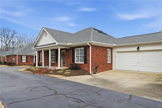 an aerial view of residential houses and outdoor space