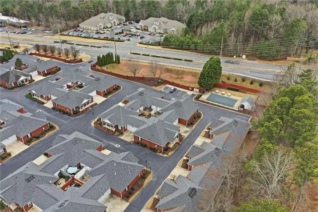 an aerial view of residential houses with outdoor space