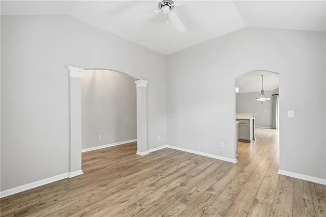 an empty room with wooden floor