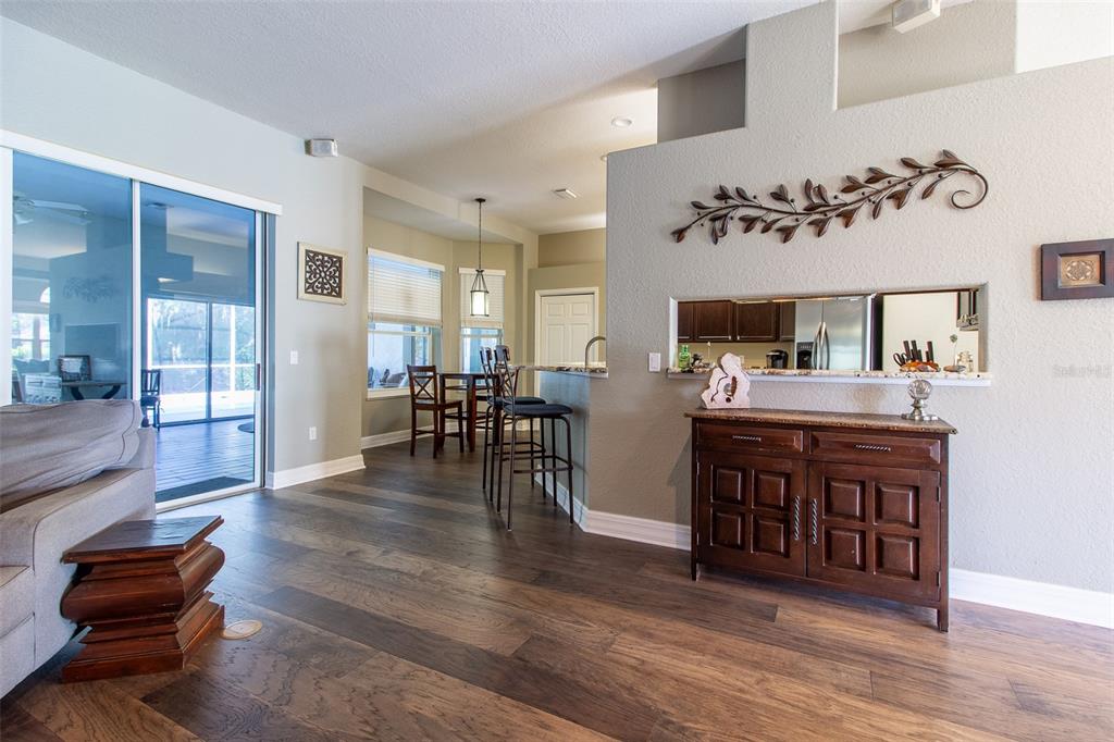 8950 Southeast 17th Court Ocala, FL 34480 - Photo 11 of 61 a room with furniture and wooden floor